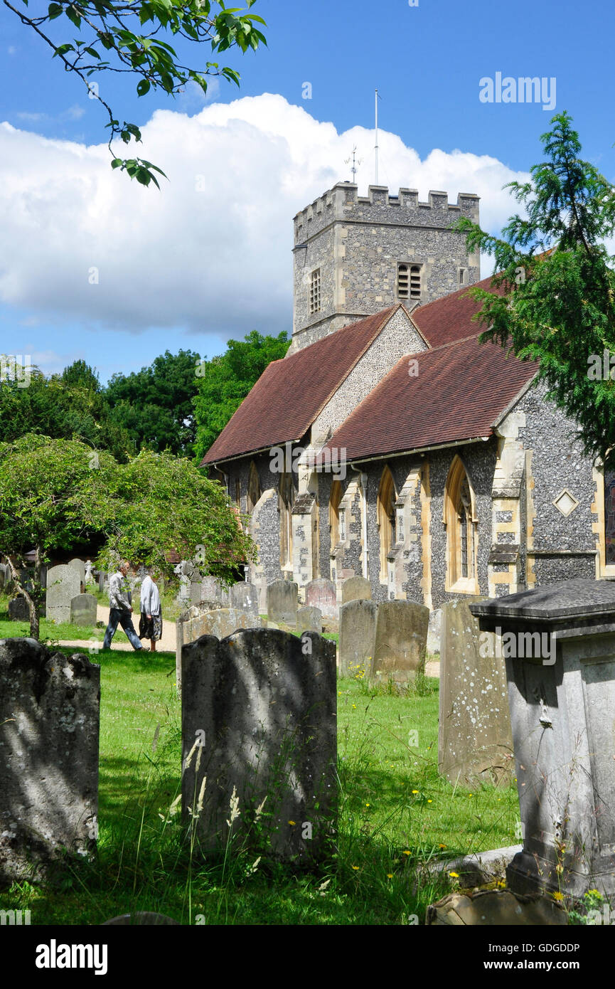 Berkshire - Sonning village - parish church of St Andrew - C13 origins - flint walls and red tiles - square tower - sun blue sky Stock Photo