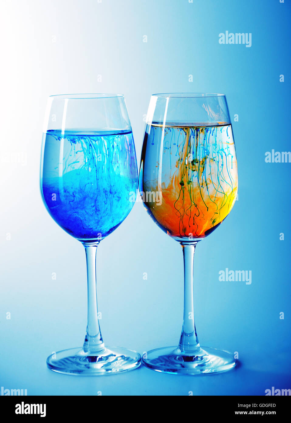 Download Two Wine Glasses Filled With Water And Spreading Red Yellow And Blue Stock Photo Alamy Yellowimages Mockups