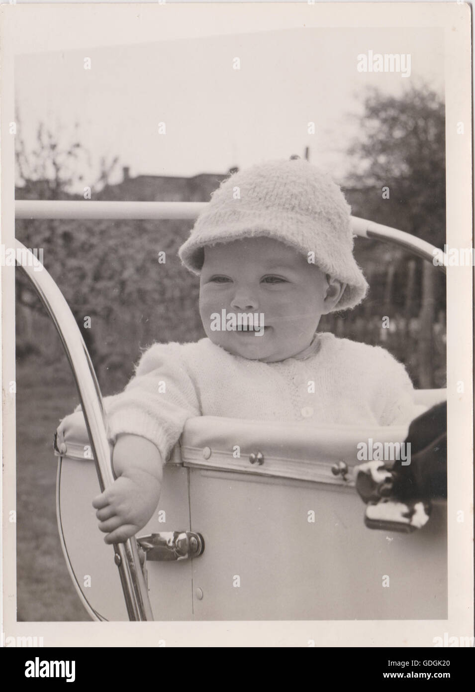 Vintage Baby in Pram wearing a hat Black & White Stock Photo