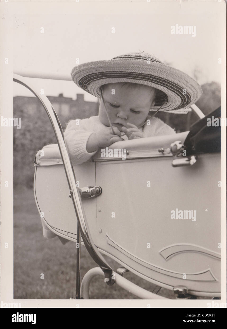 Vintage Baby in Pram wearing a hat Black & White Stock Photo