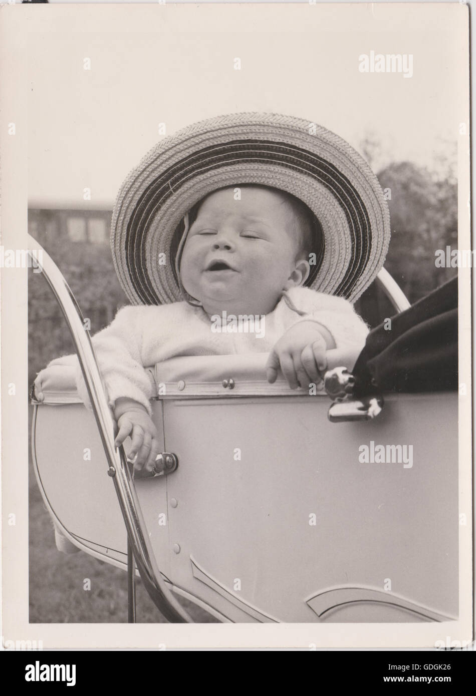 Vintage Baby in Pram wearing a hat Black & White Stock Photo