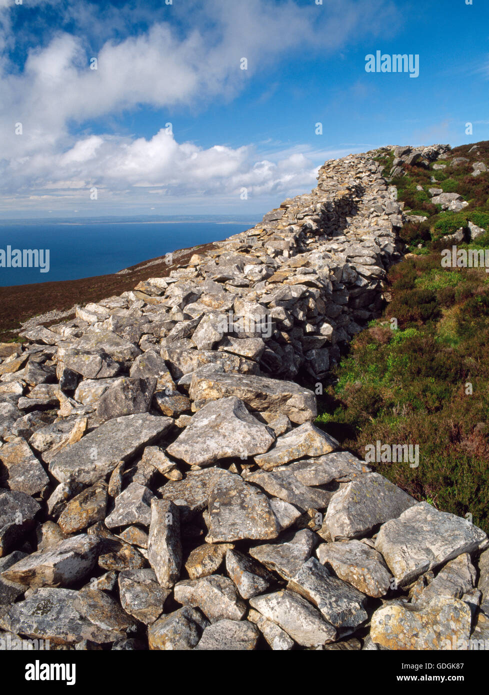 Parapet & wall-walk on NW drystone ramparts of Tre'r Ceiri hillfort (Town of the Giants), Gwynedd, an Iron Age & Roman-period fortress. Stock Photo