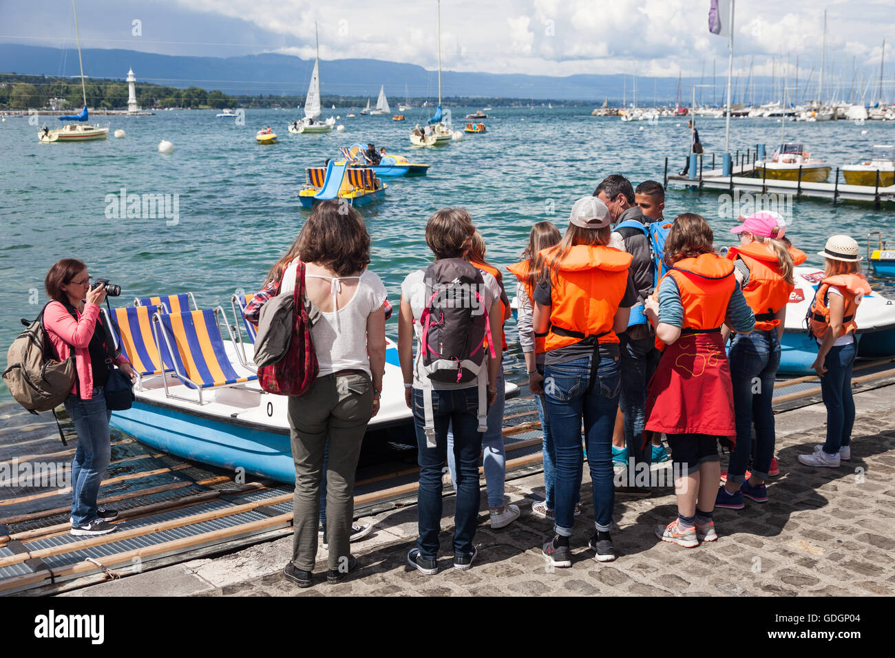 Large group getting ready to rent pedal boats on Lake Geneva Stock Photo