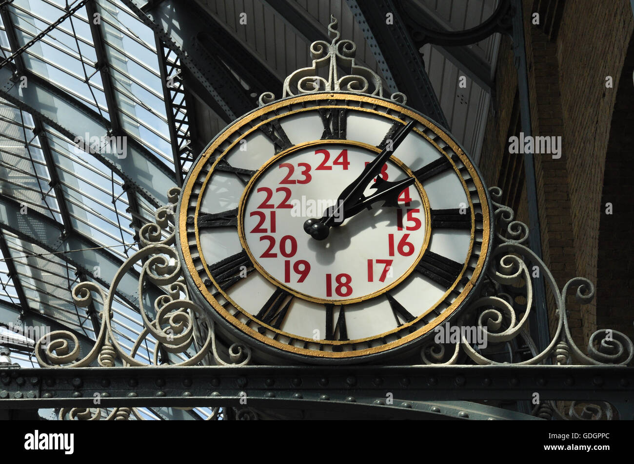 Clock at King's Cross railway station, London, England, UK Stock Photo
