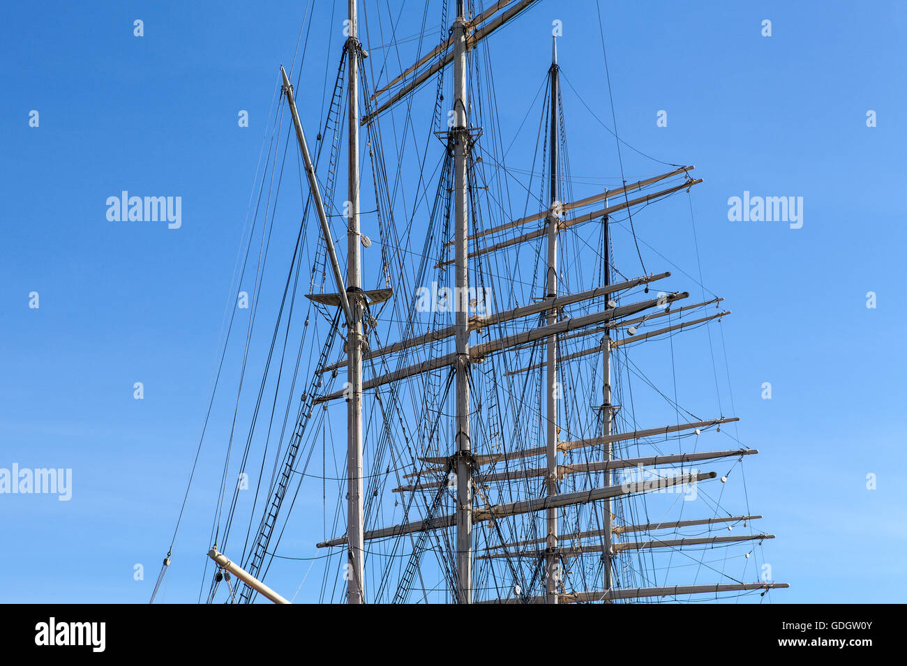 The masts and rigging on a full-rigged ship. Sky and some visible clouds. Stock Photo