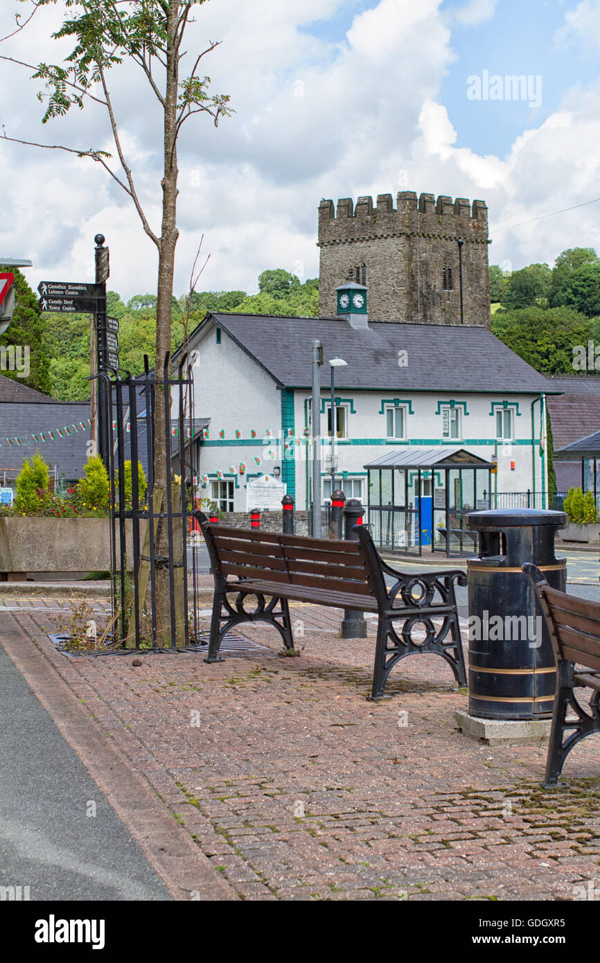 Town centre in Llandysul, Ceredigion. Showing police station and church and a bench. Shot vertically. Stock Photo