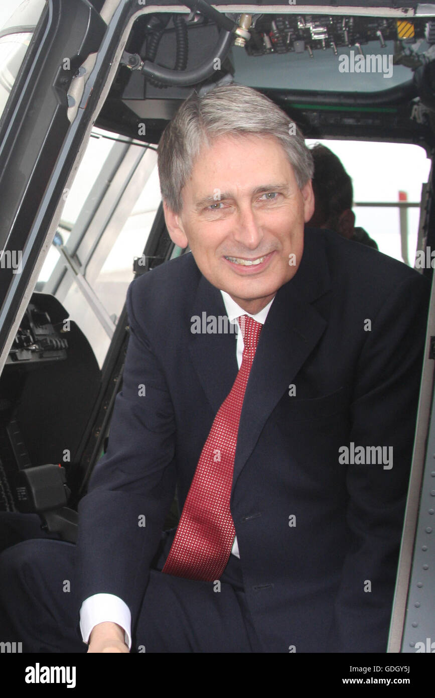 Philip Hammond, while secretary for defence, at Farnborough Air Show 2012, officially receiving Wildcat helicopters for the MOD. Stock Photo