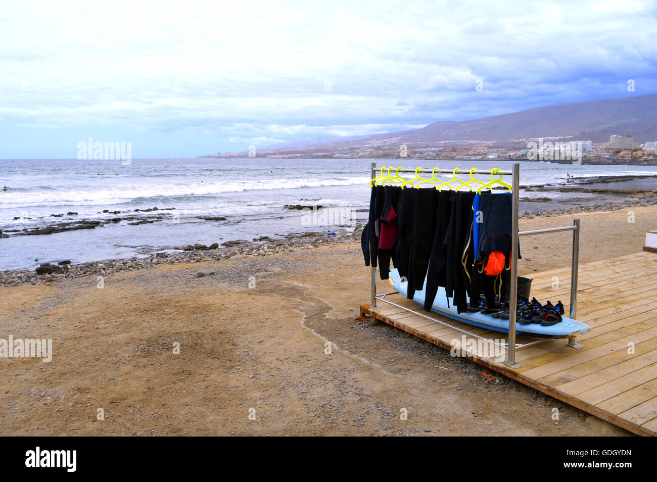 surfing wetsuits on the beach Stock Photo Alamy