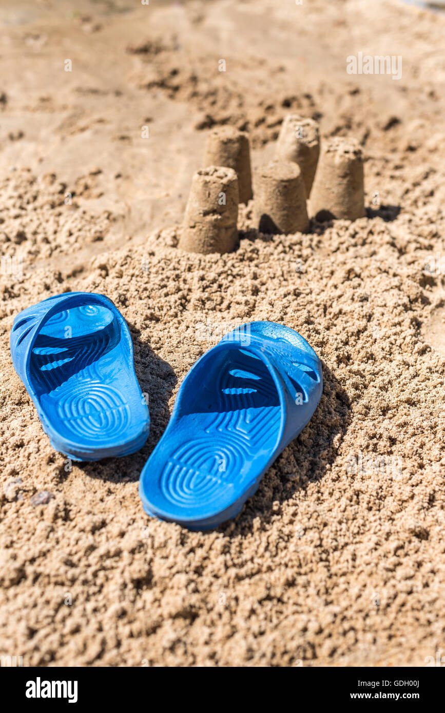 Flip-flops in the sand on the beach Stock Photo