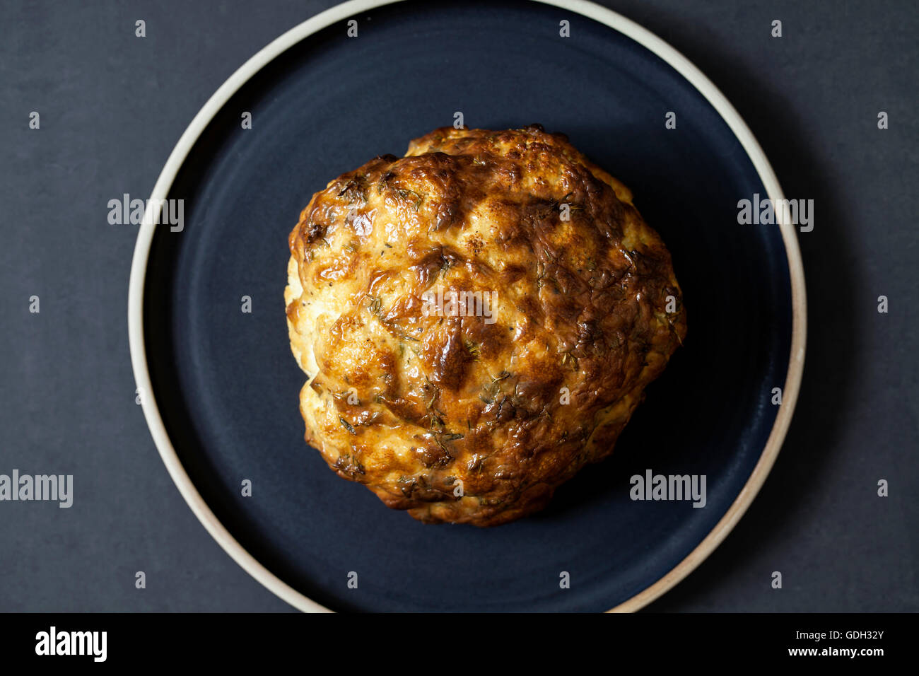 Whole roast cauliflower with mustard glaze Stock Photo Alamy