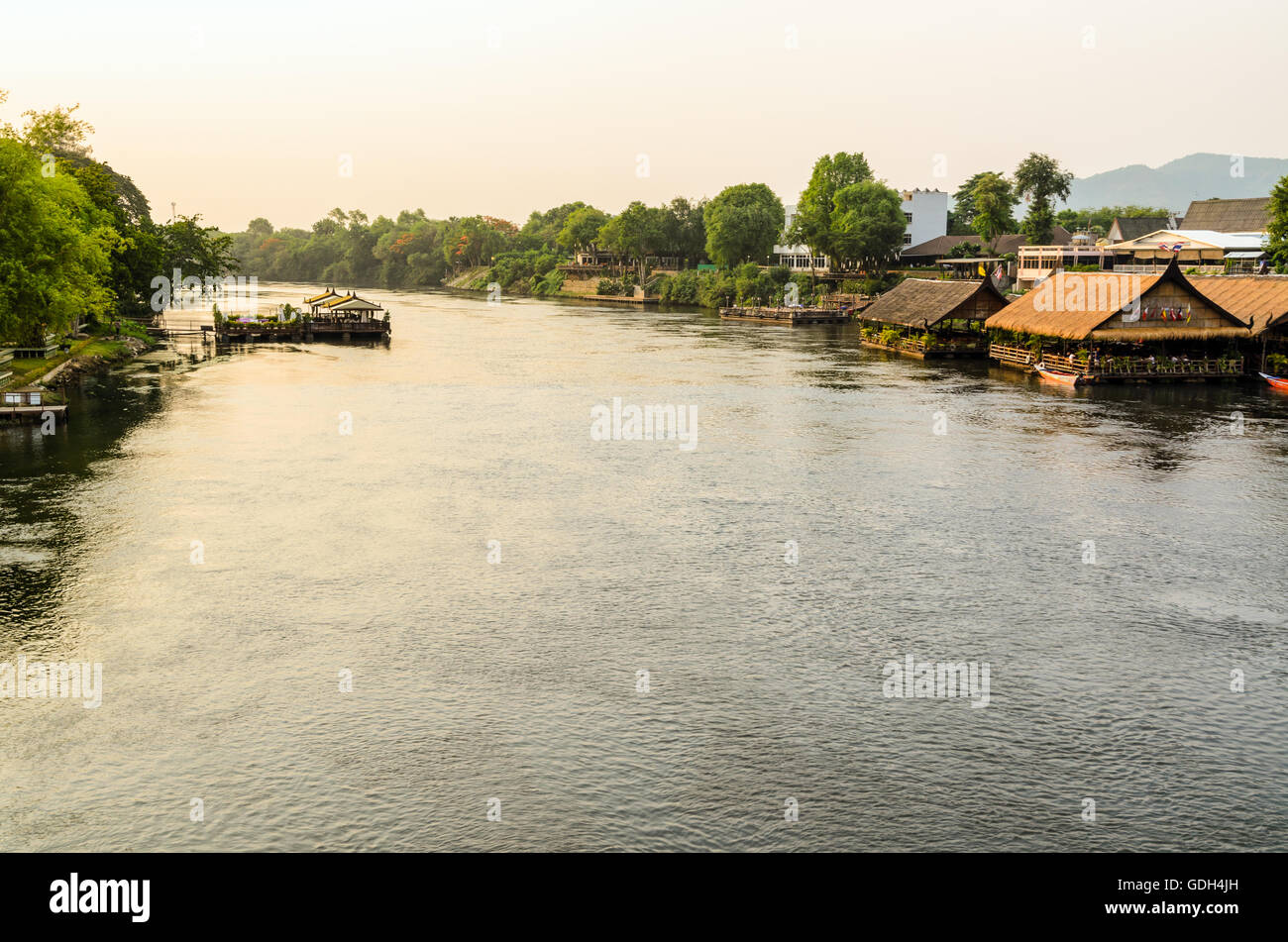 High angle view from bridge, beautiful landscape of Kwai Yai River at sunset and lifestyle of people on the waterfront in Kancha Stock Photo