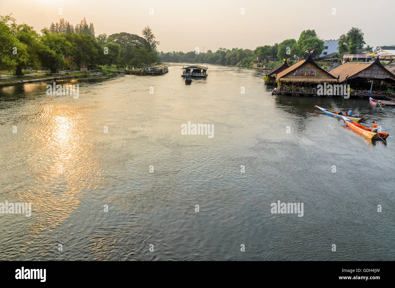 High angle view from bridge, beautiful landscape of Kwai Yai River at sunset and lifestyle of people on the waterfront in Kancha Stock Photo
