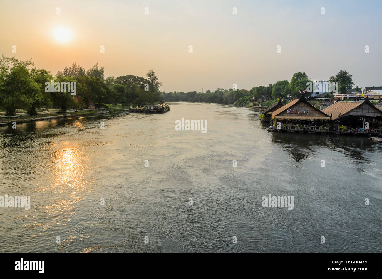 High angle view from bridge, beautiful landscape of Kwai Yai River at sunset and lifestyle of people on the waterfront in Kancha Stock Photo