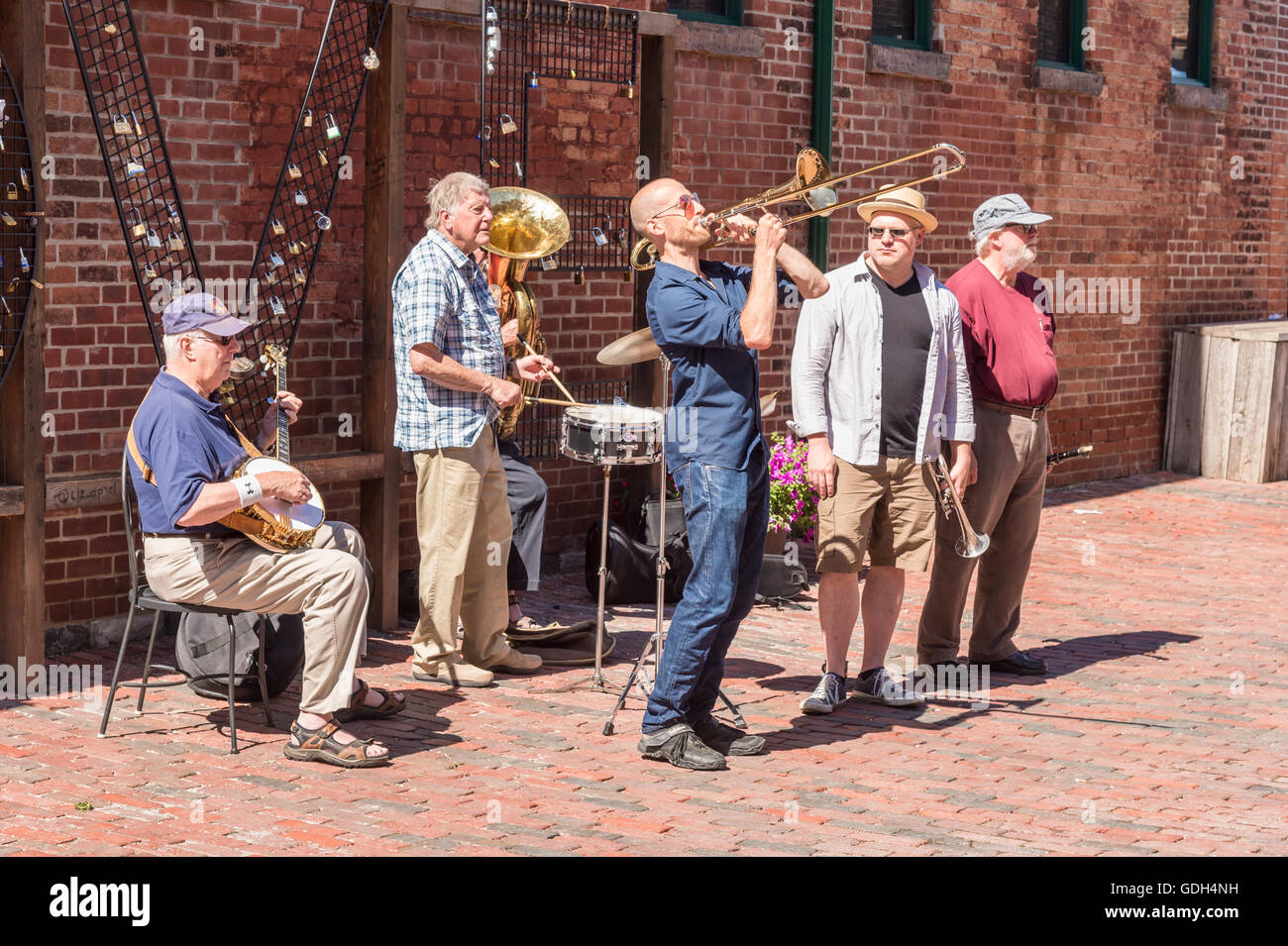 TORONTO, CANADA - JULY 1, 2016: Band playing music in the street, in Distillery District. Stock Photo