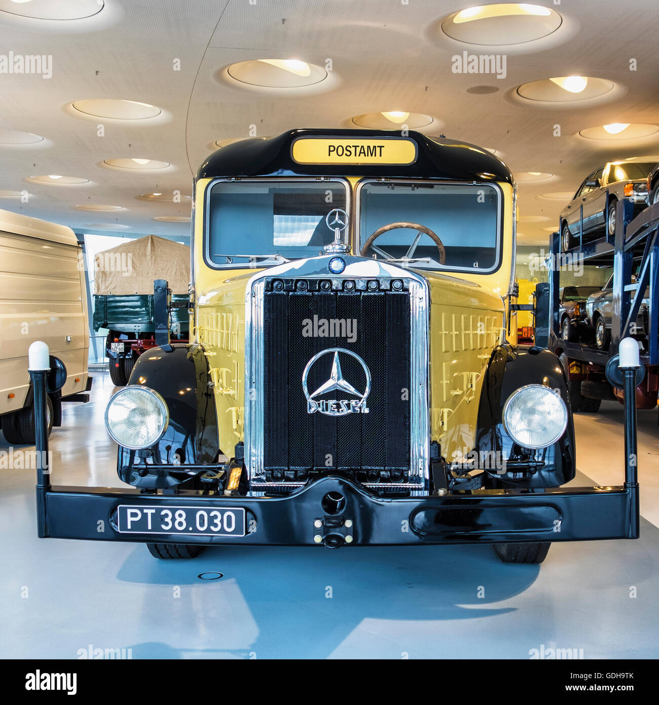 Mercedes-Benz Museum interior, Stuttgart, Germany Anterior view of vintage old postal delivery truck Stock Photo
