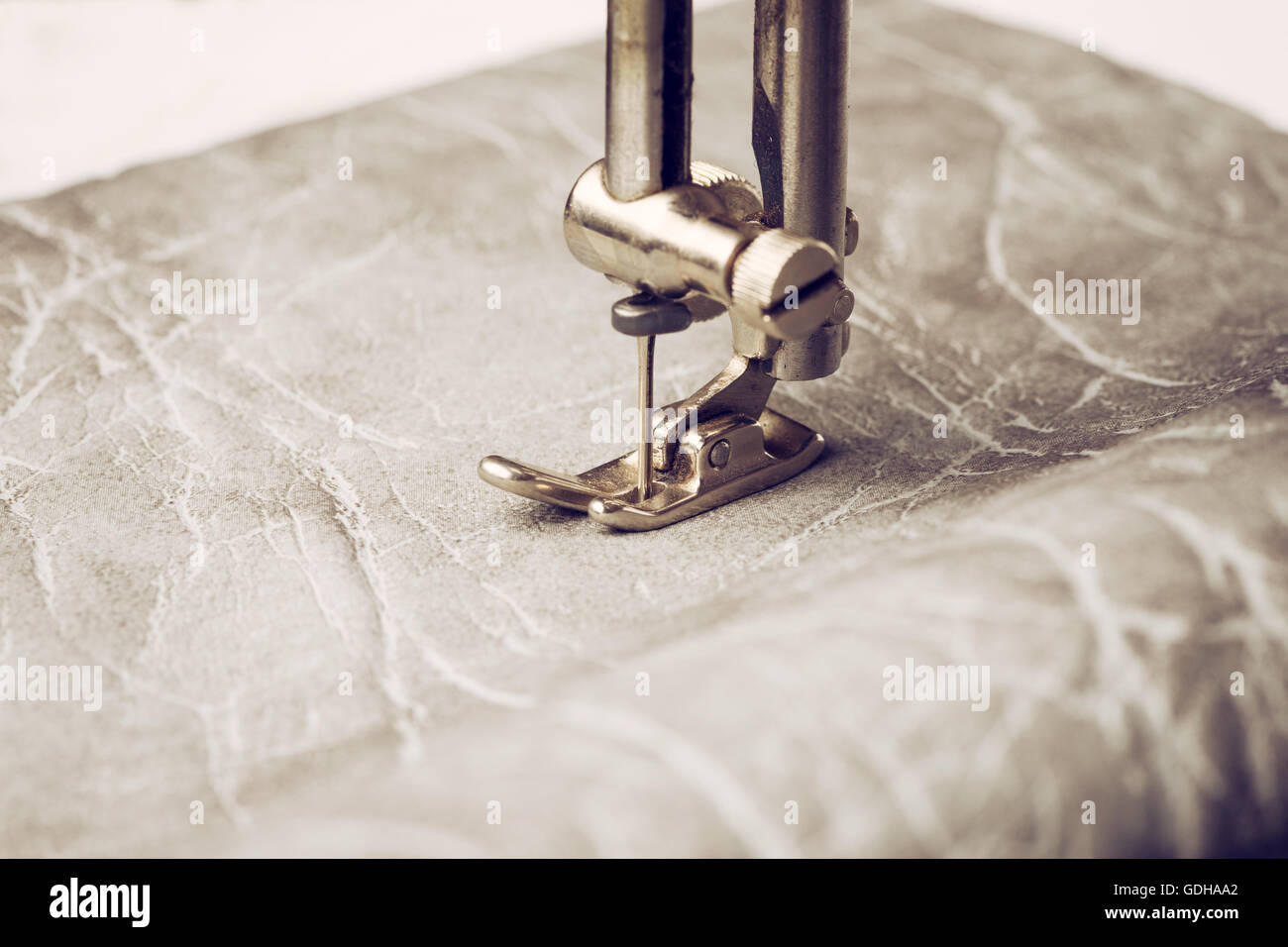 Sewing machine needle with leather Stock Photo Alamy