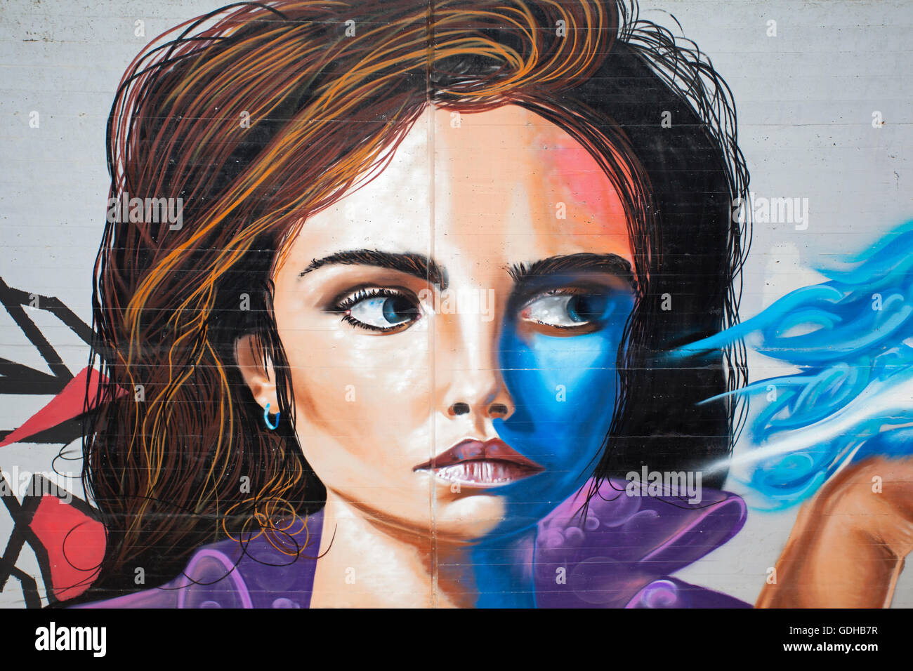 Futuristic urban portrait of a woman, street art painting on a wall in Reggio Emilia. Emilia Romagna. Italy. Stock Photo
