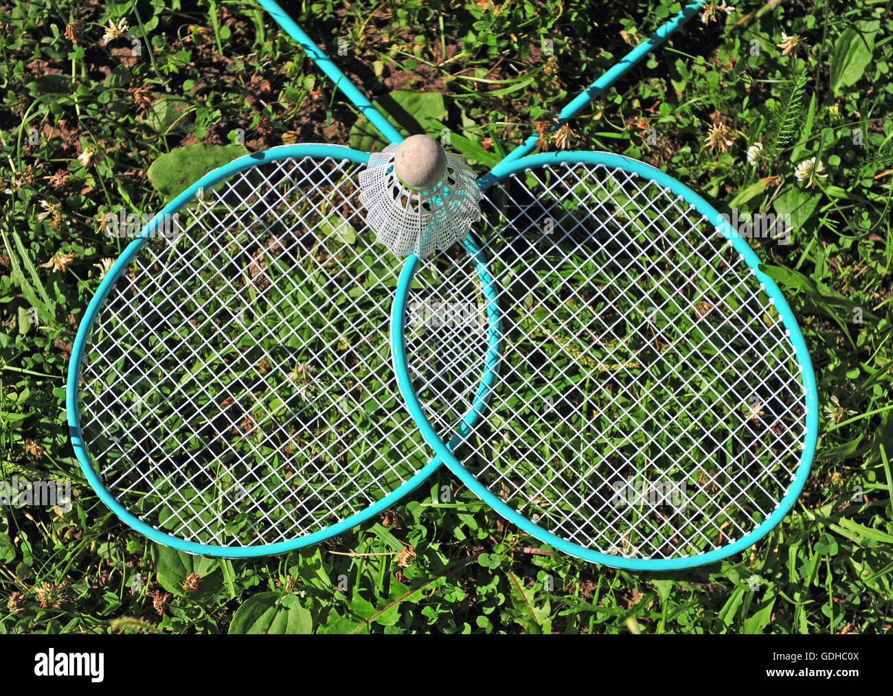 Badminton rackets in the grass Stock Photo