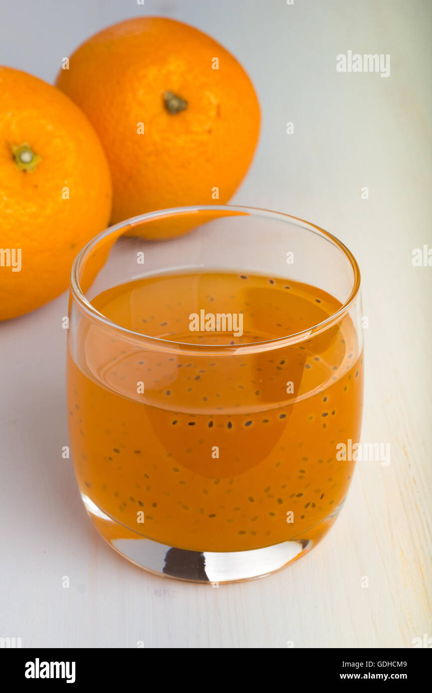 Glass of orange and basil seeds drink. Stock Photo