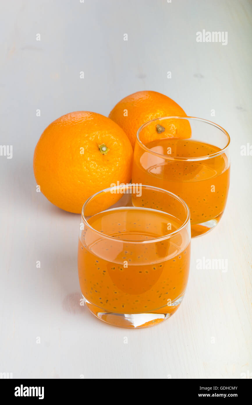 Glass of orange and basil seeds drink. Stock Photo
