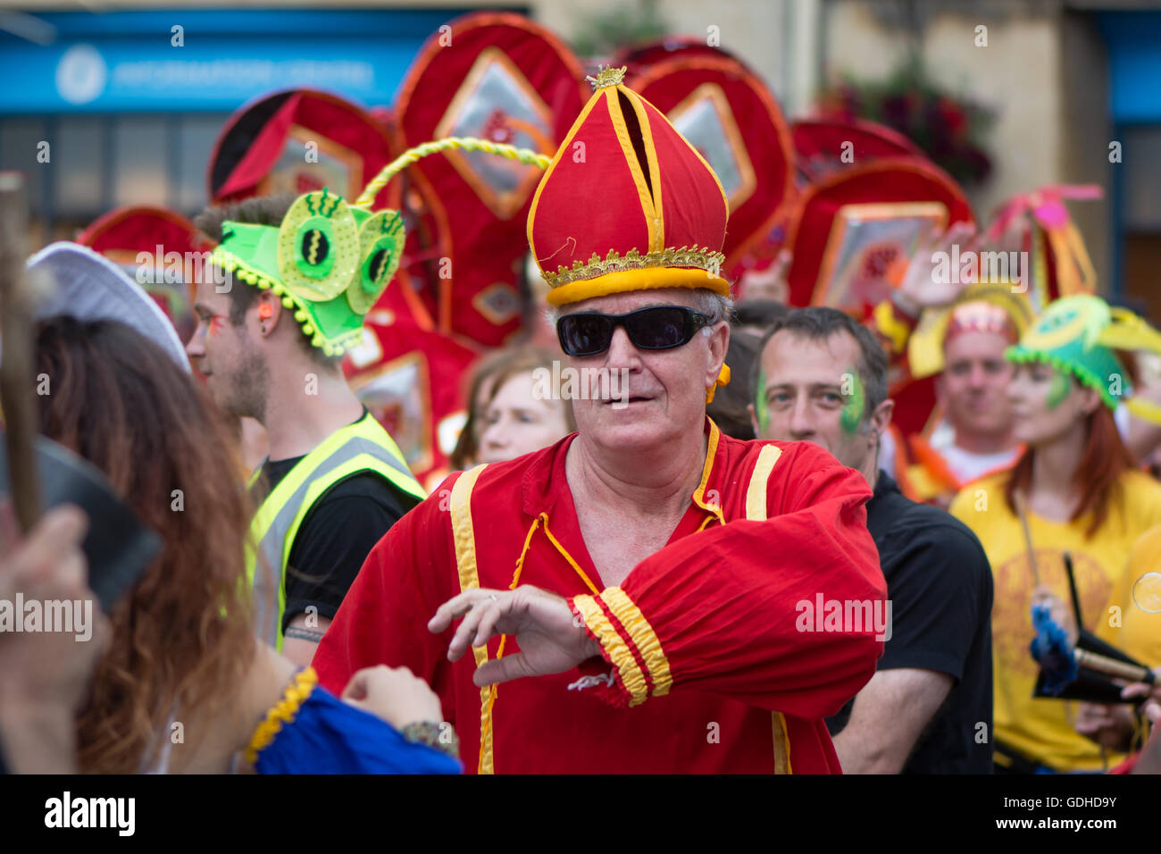 Man dressed as cardinal at Bath Carnival. Bath Carnival procession, bringing a South American festival atmosphere to Somerset Stock Photo