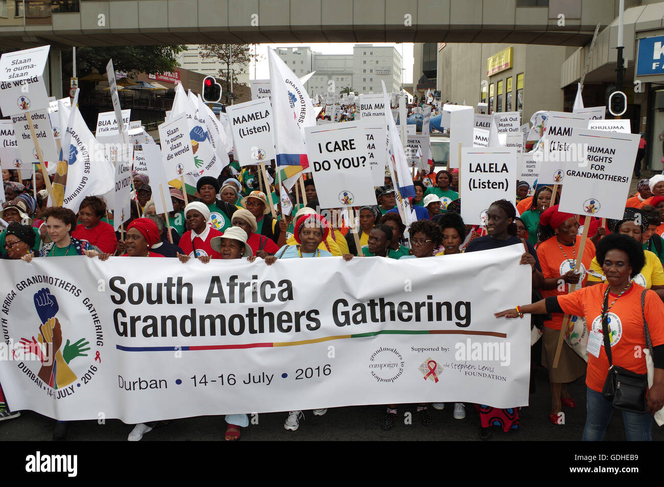 Durban, South Africa. 16th July, 2016. DURBAN - 16 July 2016 - About 1500 grandmothers marched on Durban's International Convention Centre, where the 2016 World Aids Conference is set to begin, to demand greater recognition for the plight they face and the role they face in fighting the deadly HIV/Aids epidemic that is ravaging the continent. Many children in Africa that have been orphaned by the disease are raised by their grandparents. In South Africa it is estimated that some two million children have been orphaned by the disease. Picture Credit:  Giordano Stolley/Alamy Live News Stock Photo