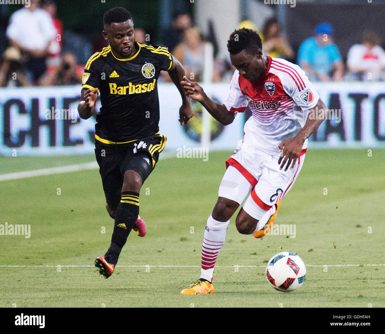Columbus, U.S.A. 16th July, 2016. July 16, 2016: D.C. United midfielder Lloyd Sam (8) fights for the ball in the match against Columbus Crew SC defender Waylon Francis (14). Columbus, Ohio, USA. (Brent Clark/Alamy Live News) Stock Photo