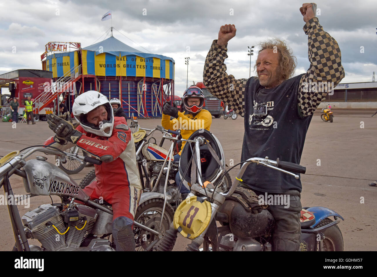 Kings Lynn, Norfolk, United Kingdom. 16.07.2016. Fifth annual Dirt Quake festival at the Adrian Flux Arena, Norfolk. Dirt Quake is racing road bikes on a dirt track. Lorry mechanic, Mortorbike Racer and TV celebrity Guy Martin races on a Crazy Horse Harley Davidson (pictured, loosing to Odgie) and World Superbike racer, Carl Fogerty MBE races a Triumph. Classes include Inappropriate Road Bike, Ladies, and Street Tracker. Stock Photo