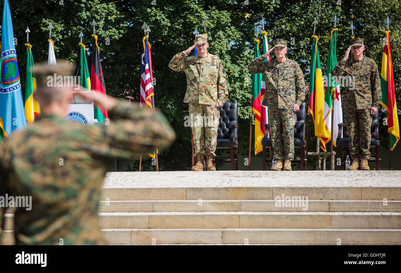 Stuttgart, Germany. 18th July, 2016. The new commander-in-chief of the Africa Commando of the US Army (Africom), Thomas Waldhauser (R), is introduced during the ceremonial handover of the commando at the site of the US army outpost 'Patch Barracks' in Stuttgart, Germany, 18 July 2016. The old commander-in-chief David Rodriguez (L) and the Chairman of the Joint Chiefs of Staff, Commander Joseph Dunford (C), stand next to them. Photo: CHRISTOPH SCHMIDT/dpa/Alamy Live News Stock Photo