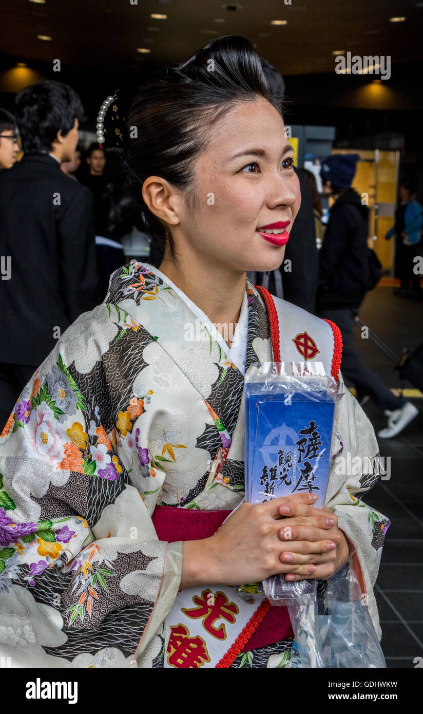 Lady wearing traditional Japanese Kimono at event promoting tourism at Kyoto railway station Japan Stock Photo