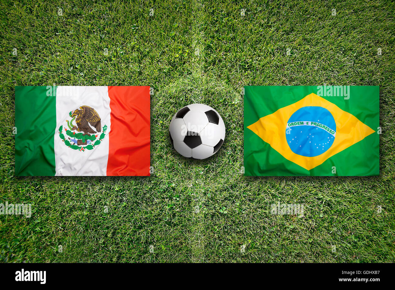 Mexico vs. Brazil flags on green soccer field Stock Photo Alamy