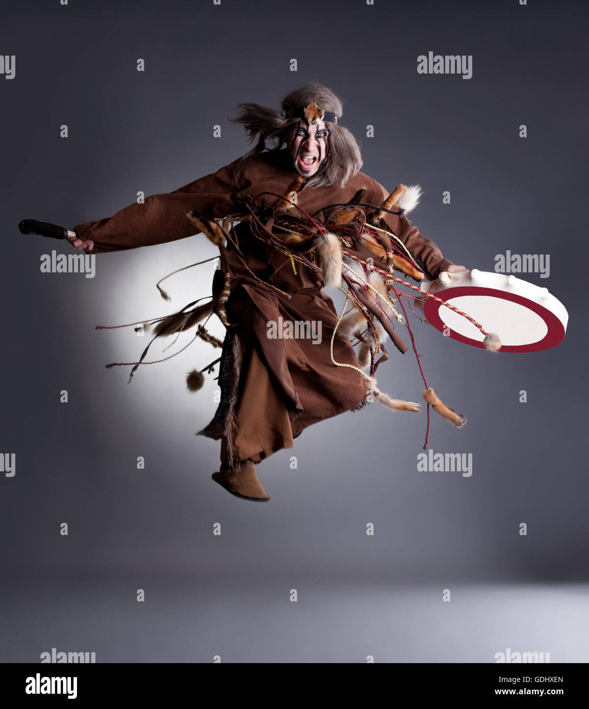 Studio shot of angry shaman posing in jump Stock Photo