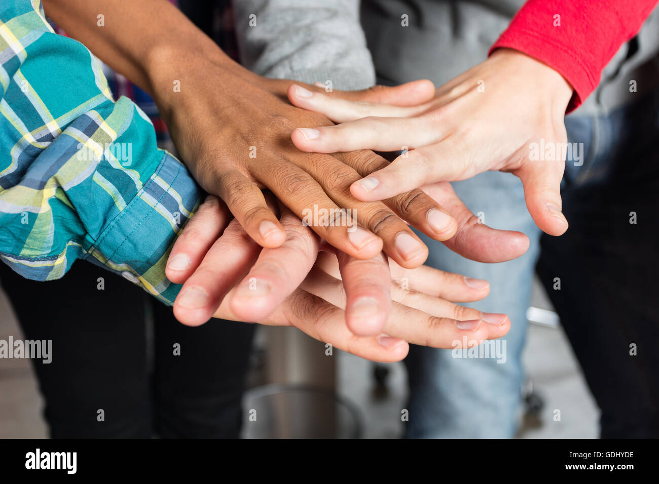 Hands on top of each other business hi-res stock photography and images ...