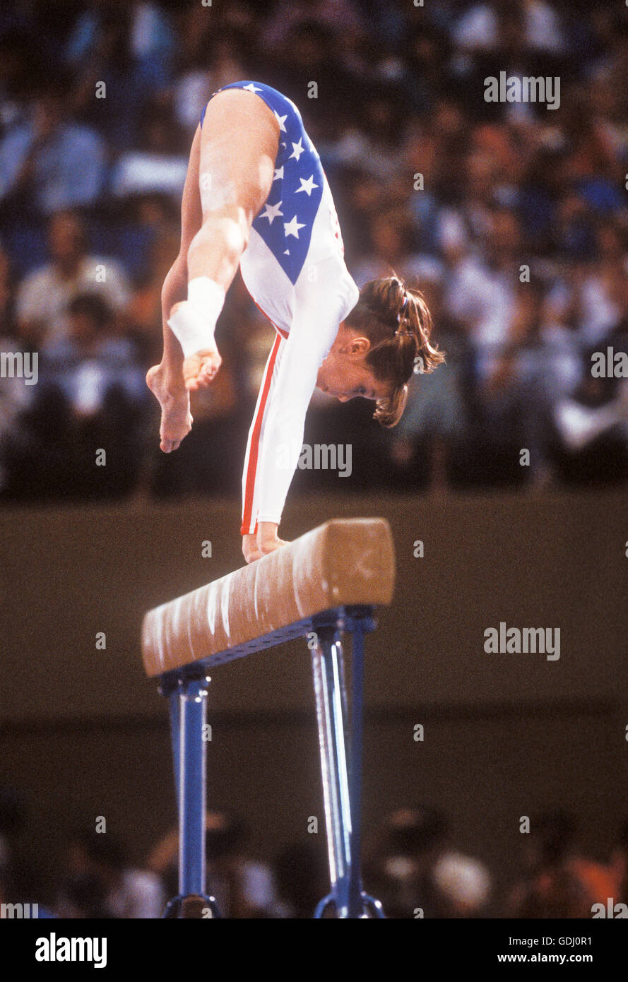 Michelle Dusserre performs on balance beam during competition at 1984 Olympic Games in Los Angeles. Stock Photo