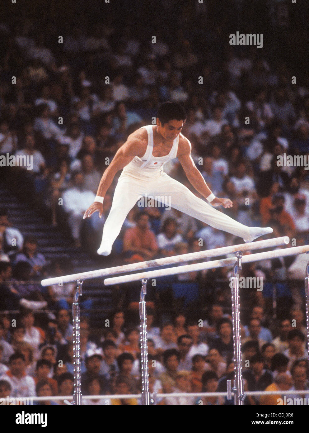 Koji Gushiken of Japan performs on parallel bars at 1984 Olympic Games in Los Angeles. Stock Photo