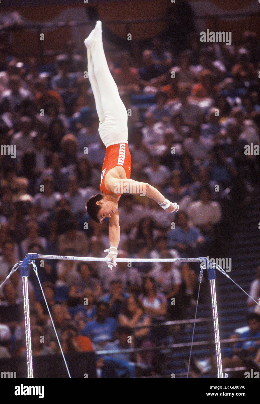 Ning Li of China performs on horizontal bar at 1984 Olympic Games in Los Angeles. Stock Photo