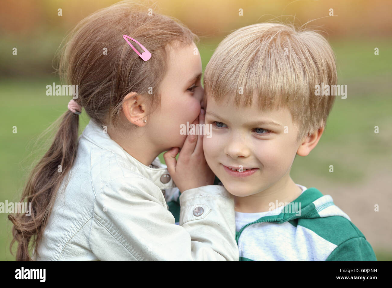 boy and girl playing outside Stock Photo Alamy