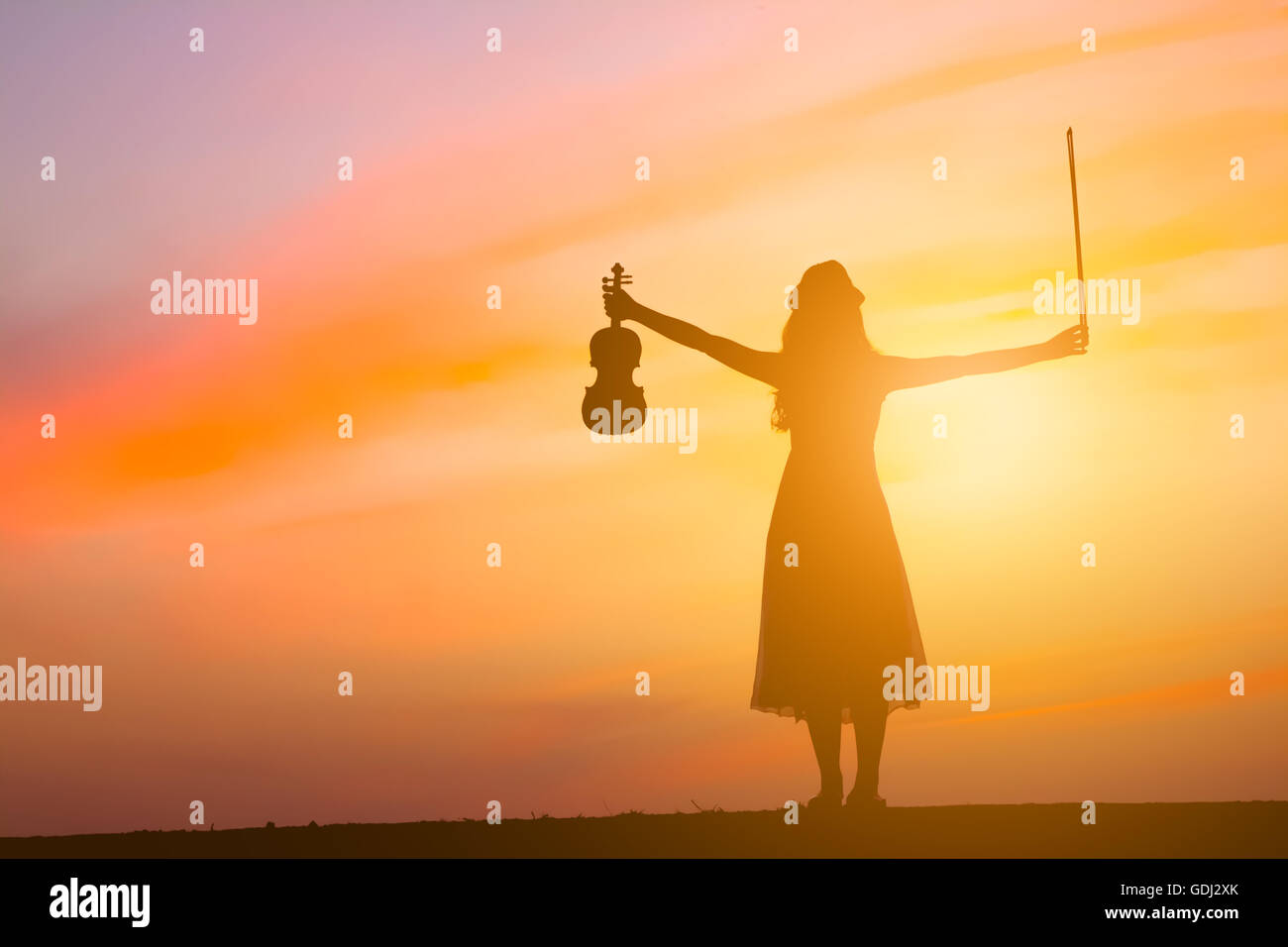 Silhouette woman playing violin hi-res stock photography and images - Alamy