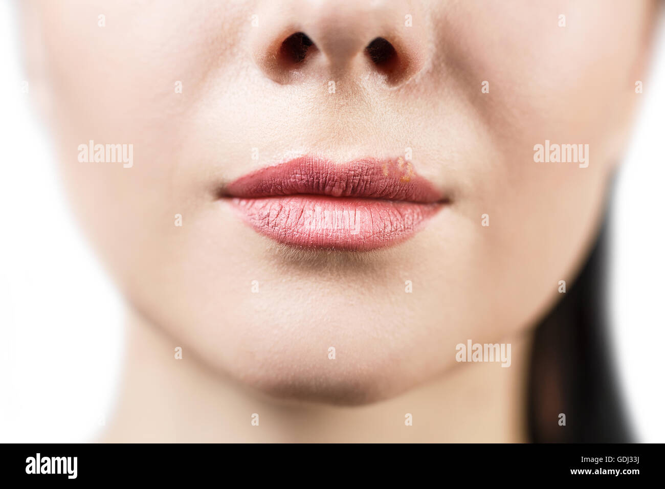 Beautiful lips infected herpes virus over white background Stock Photo