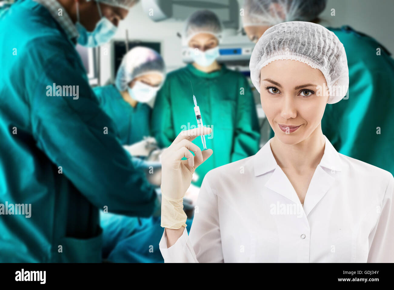 Young female anesthetist with syringe on the surgery teem background Stock Photo Alamy