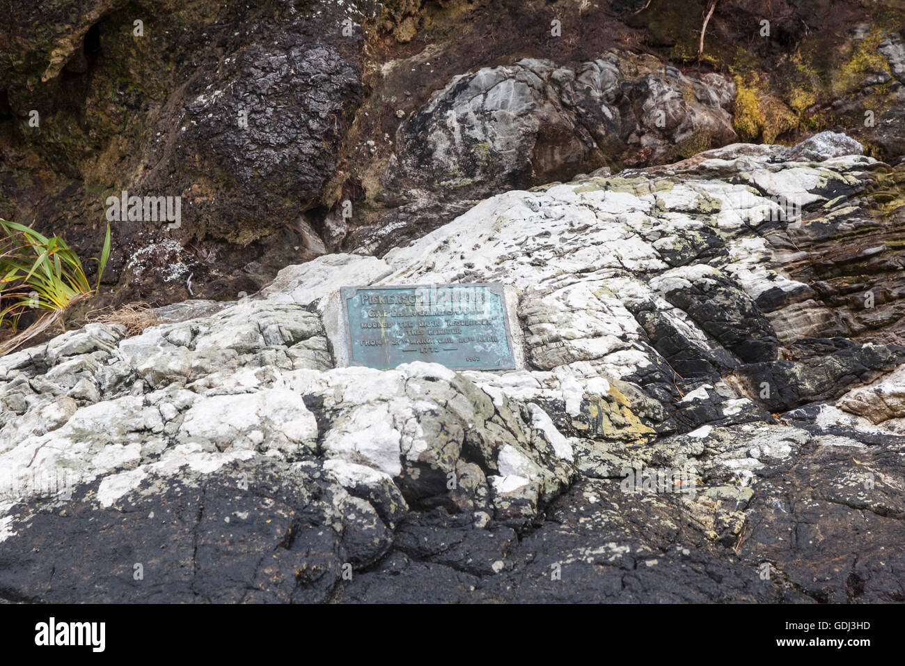 Plaque in Pickersgill Harbour, commermorating Captain Cook's visit in 1773, Dusky Sound,  Fiordland, New Zealand Stock Photo