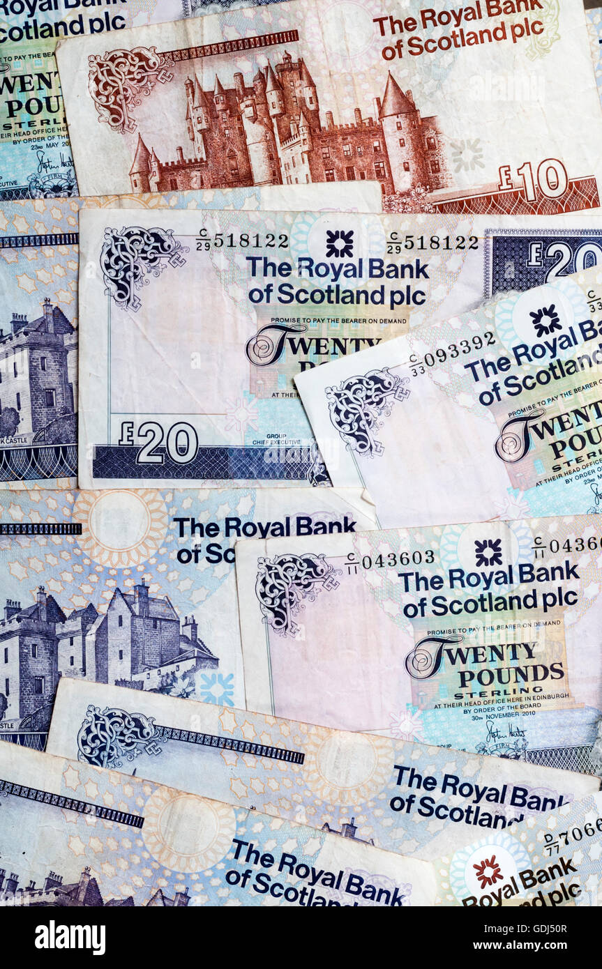 A pile of Scottish £10 (ten pound) and £20 (twenty pound) notes issued by the Royal Bank of Scotland plc. Stock Photo