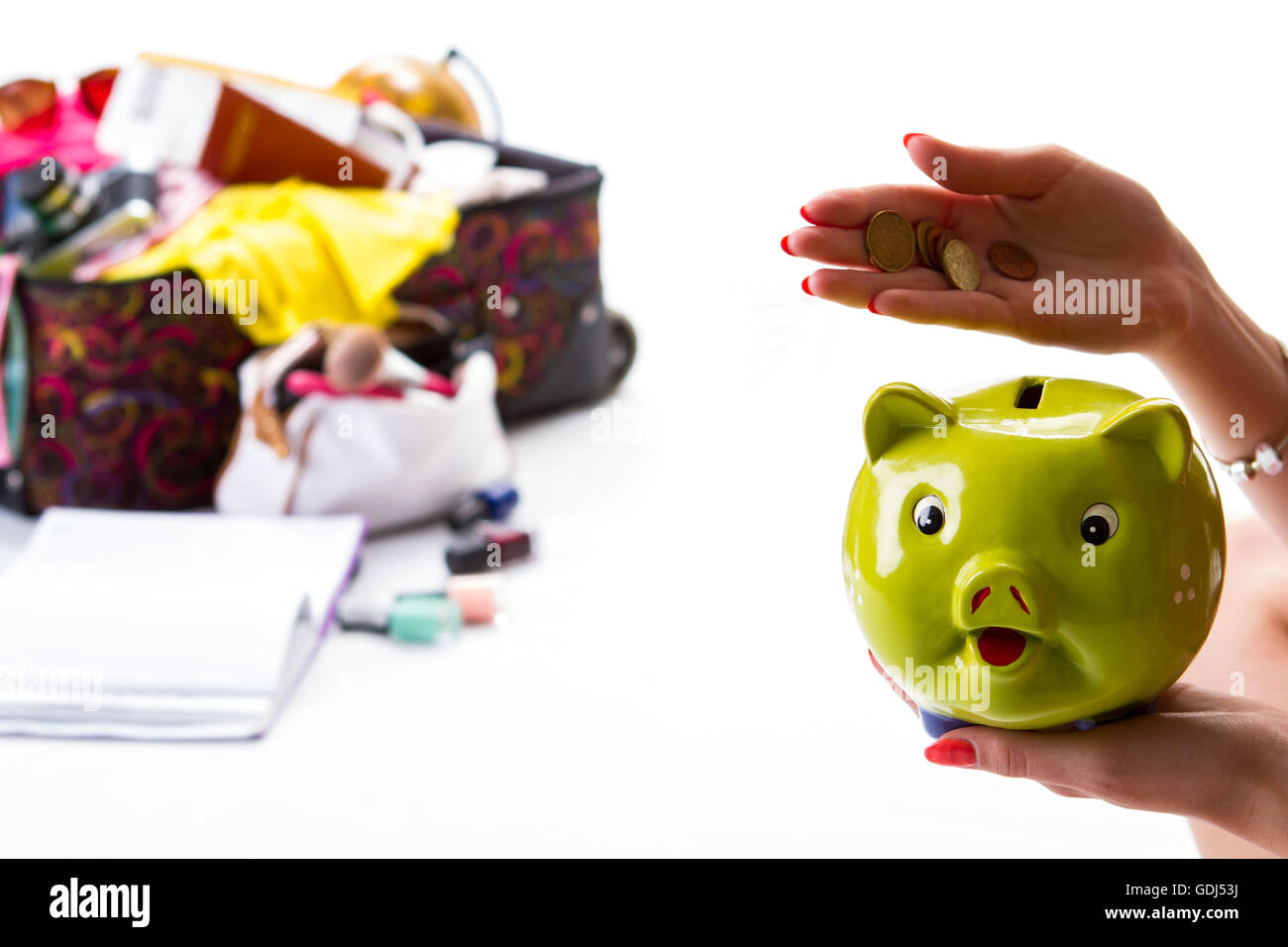 Girl's hand holding piggy bank Stock Photo - Alamy
