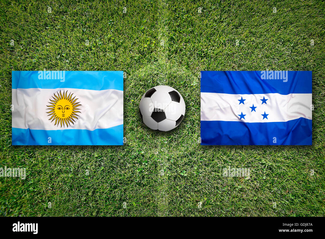 Brazil vs. Honduras flags on green soccer field Stock Photo Alamy
