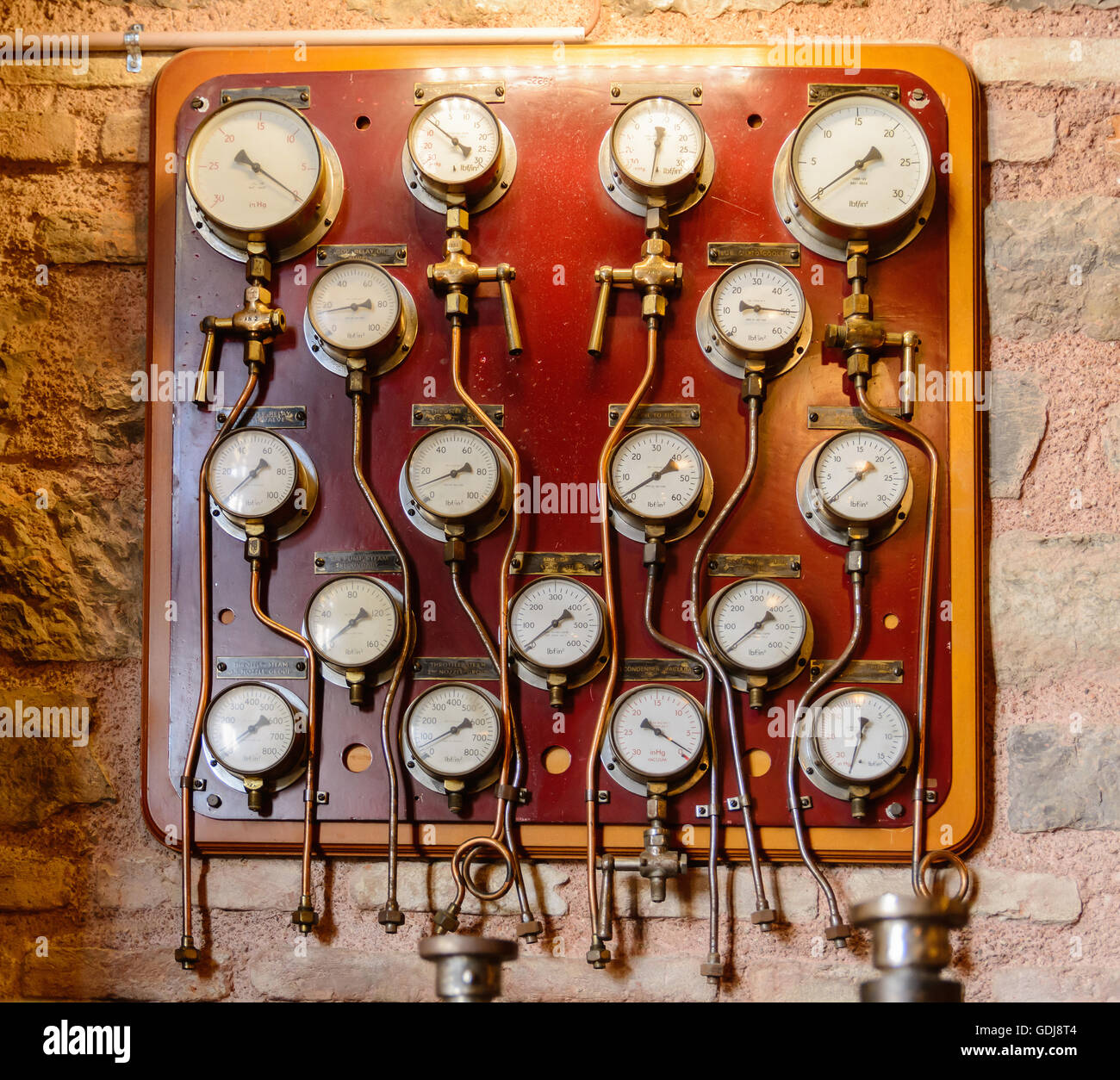 plurality of circular white dials and gauges to measure precise control Stock Photo