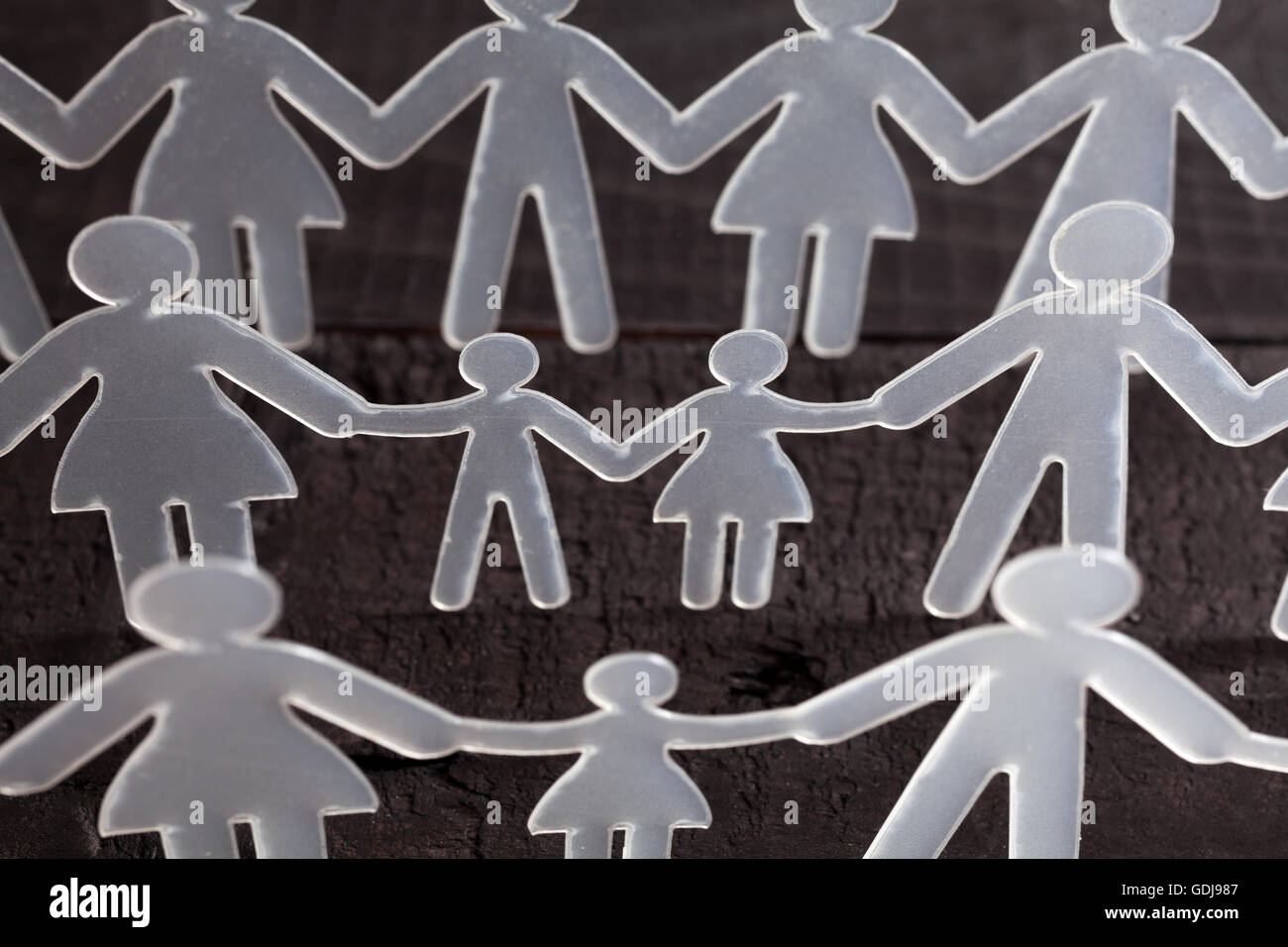 Human chain on black background Stock Photo