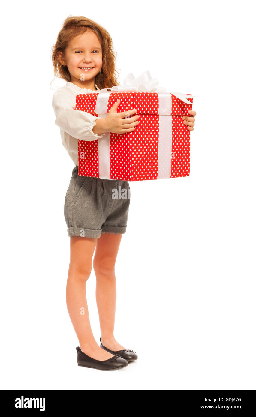 Full height portrait of little girl with present Stock Photo - Alamy