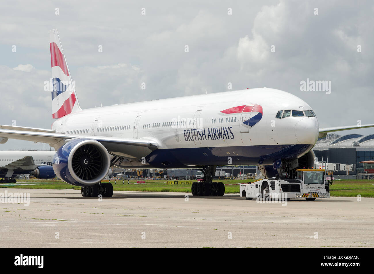 British Airways Boeing 777 being towed to stand at London Heathrow Airport Stock Photo