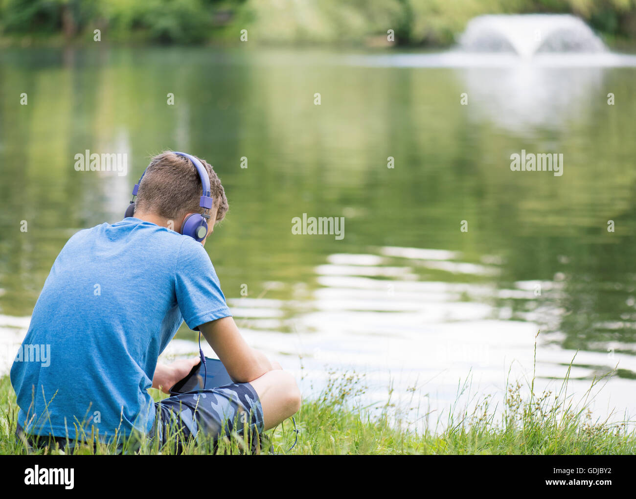 Teen boy earphones outdoors hi-res stock photography and images - Alamy