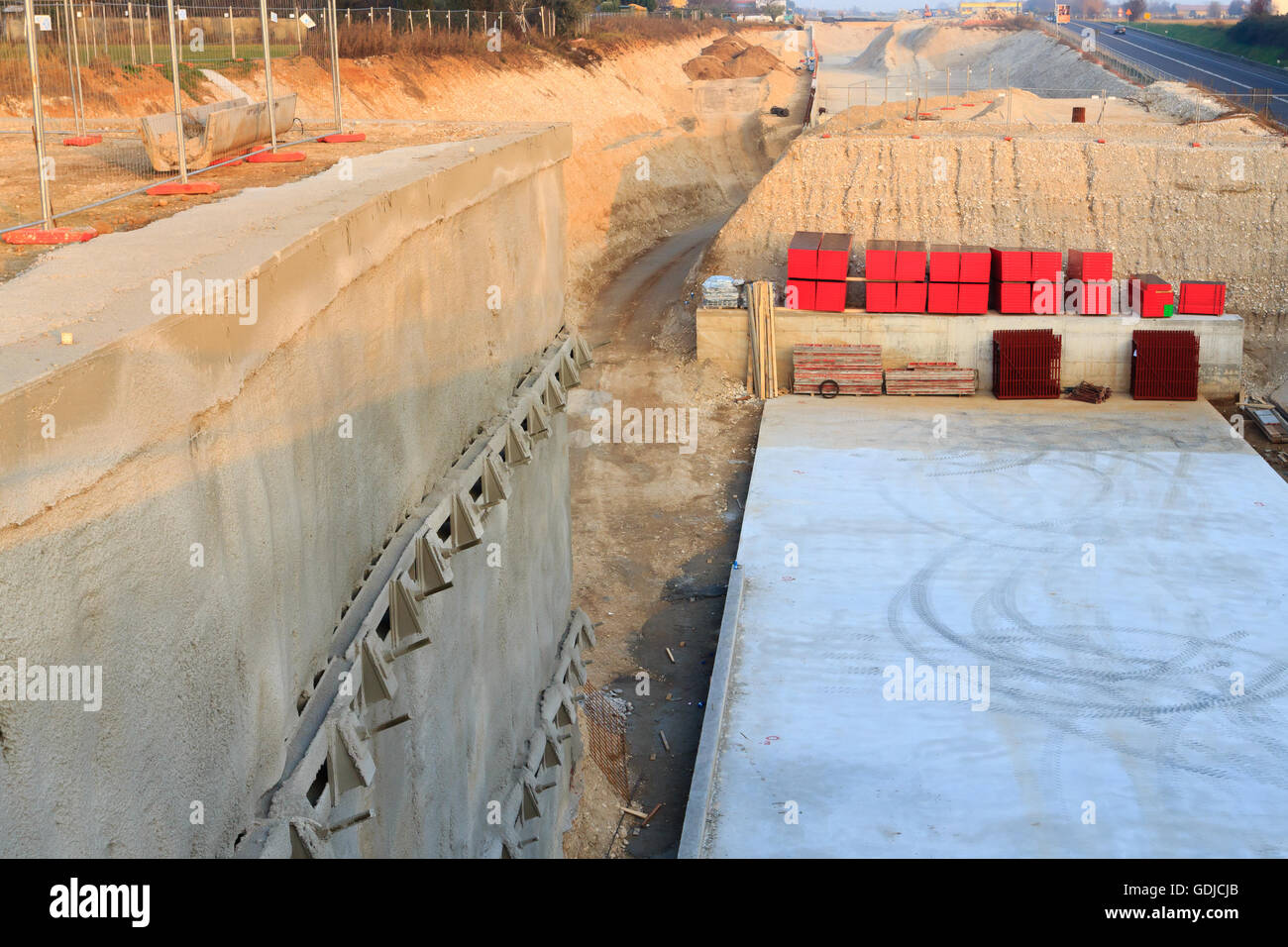 Detail of a road construction site for a new highway. Civil Engineering. Industrial Stock Photo